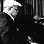 Photograph of Erbie Bowser playing the piano